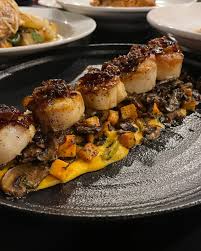 Lucca Restaurant & Bar signature dishes Veal SaltimboccaAgnolotti di ZuccaPan Seared Scallops